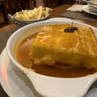Tofu Francesinha with a side of fries (paid separately )  at Francesinhas Al Forno da Baixa in Porto