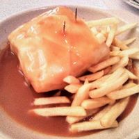 Seitan Francesinha with french fries and v-cheese the one I ate at Francesinhas Al Forno da Baixa in Porto