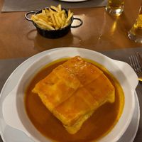 Francesinha curry with fries at Francesinhas Al Forno da Baixa in Porto