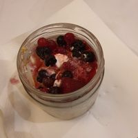 Partly eaten wild fruits cheesecake at Francesinhas Al Forno da Baixa in Porto