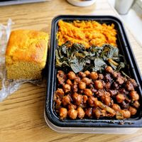 Jerk chickpeas,  collard greens, mashed sweet potatoes and cornbread 😋. at The Nile Cafe in Philadelphia
