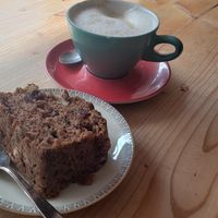 Vegan cinnamon cranberry bread, latte with oat milk.  at Airtime Cafe in Lauterbrunnen