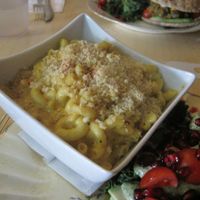 This is the vegan mac n cheese and it is really good. It doesn't taste like commercial vegan cheese; it may be nutritional yeast or cashew-based. It was served really hot too, which I appreciated. at Le Doggy Cafe in Montreal