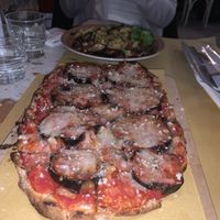 My vegan aubergine pizza and my girlfriends vegan meatballs with vegetables at Buddy VEGGY in Rome