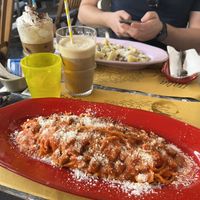 Pasta Amatriciana (tomato based) and carbonara (opposite) with iced coffees   at Buddy VEGGY in Rome