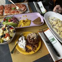 Pizza margarita, vegan omelette, carbonara, pancakes with chocolate, fruit bowl.  at Buddy VEGGY in Rome