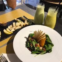 partially eaten fruit plate , smoothies and antioxidant salad at Buddy VEGGY in Rome
