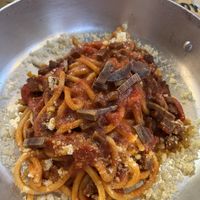 Vegan Amatriciana

Tomato sauce, *vegan bacon, vegan cheese.  at Buddy VEGGY in Rome