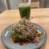 Avocado on toast- their homemade bread and so many lovely extra garnishes on the meal. The drink is a detox juice and it tasted great!  at roots - Lintheschergasse in Zurich