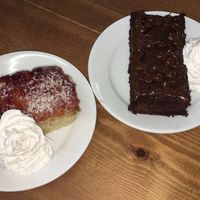 raspberry coconut cake and chocolate brownie with whipped cream at Oh My Goodness in Eastbourne