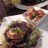 quinoa/beetroot Patty with Indian-spiced Potatoes, green salad and flatbread with carrot-Hummus, Delicious! at Momo Restaurant in Waterford