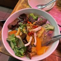 V duck yellow noodle soup, and an empty bowl of Tom yum soup   at Golden Lotus Vegan in Newtown
