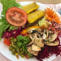 Lentil and polenta roll, parmigiana tofu and mixed salad  at Sabores Naturais in Seixal