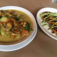 Coconut curry with a side of sweet potato cakes.  at 21 Oak in Manchester