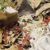 I personally like melted cheese on my nachos, not shredded cheese directly from the bag still cold and the rest of the nachos were kind of meh    at Mad Mex in Erie