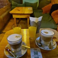 Lattes and 🍊 juice at Recyclo Bike Cafe in Malaga