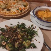 Vegetable pizza, supergreen salad and patatas bravas at Vegetalia - Born in Barcelona