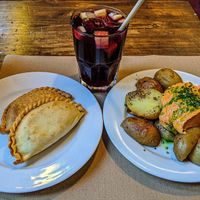 Dos empanadas y patatas bravas con sangria. at Vegetalia - Born in Barcelona