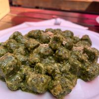 Gnocchi di spinaci con pesto e panna at Rifugio Vajolet in Vigo Di Fassa