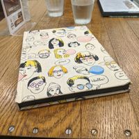 Menu cover at Apprivoiser Whole Food Cafe in Kyoto