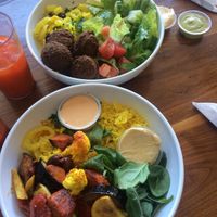 Roasted veg bowl, falafel bowl, house made carrot juice. at Shish Cafe in St Paul