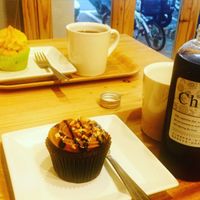Yummy peanut and pineapple cupcakes with cold and hot coffee. at Green Bakery in Taipei