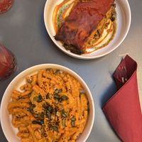 Parmigiana and pasta  at Botanica Lab in Bologna