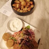 Falafel and baked potatoes at Botanica Lab in Bologna