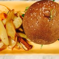Quinoa Burger w. Oven-cooked Chips, Caramelised Onions & Homemade Sauces at Botanica Lab in Bologna