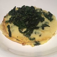 Chickpea crepes with parsnip cream and crunchy kale at Botanica Lab in Bologna