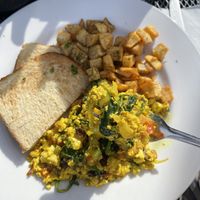 Flavorful tofu scramble with olives, banana peppers, zucchini and spinach. Wonderful !  at Artemis Lakefront Cafe in South Lake Tahoe