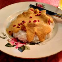 Fried cauliflower with walnut sauce, served over grits at Kafe Leila in Tbilisi