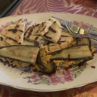 Fried eggplants made with a spicy walnut paste, fried eggplant, corn bread, and tahini cream.   at Kafe Leila in Tbilisi