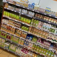 Wall of non dairy milks  at L'Eau Vive in Courbevoie