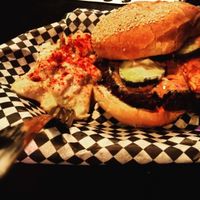 Peanut butter and tempeh bacon burger with potatoe salad, b&b pickles at Black Water Bar in Portland