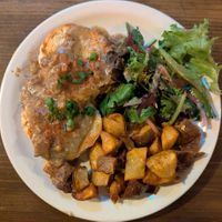 biscuits and gravy, smoked paprika home fries, and hibiscus vinaigrette salad at Black Water Bar in Portland
