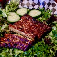 Baked tempeh on greens at Black Water Bar in Portland
