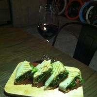 a glass of red wine, and a Mexican seitan wrap at Happy Buddha - Pop-Up in Shanghai