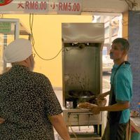 Char Koay Teow preparation. at Blue Boy Vegetarian Food Centre in Kuala Lumpur