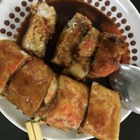 Vegan fried radish cake and popiah drenched in chilli and sweet soy sauce  at Blue Boy Vegetarian Food Centre in Kuala Lumpur