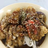 Chee cheong fun (flat rice noodles with sesame hoisin sauce, fried tofu skin, stuffed chilli and eggplant) at Blue Boy Vegetarian Food Centre in Kuala Lumpur