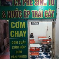 The restaurant with the proprietor. She doesn't speak English but she is friendly and has a warm smile. at Tu Hao in Hanoi