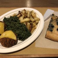 Quinoa muffins, spinach pearl cous cous, roast rosemary potatoes and spinach pizza at Radicetonda - Piazza Buozzi in Milan