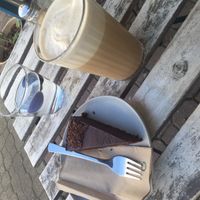 Soy shakerato and vegan GF chocolate cake  at Schondorf Bio Cafe in Bratislava