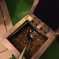 decorated metal box with inside many digestive mixed seeds at Veg World India in Barcelona