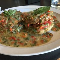 (All vegan) Tomato, Avocado, Vegan Sausage and Pepper Gravy Sauce over Biscuits  at Hackberry's Bistro in La Crosse