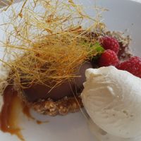 Chocolate and ganache tart with a mixed nut and date base, salted caramel, spun sugar and vanilla ice cream. One of the best desserts I've ever eaten. at Rootcandi in Brighton