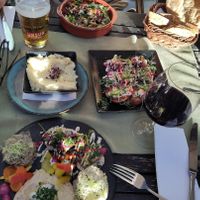 At the bottom: small vegan plate. Above: mashed potato and fried eggplant with tahini. Top: plate with mushrooms and hummus + bread at Aubergine in Bucharest