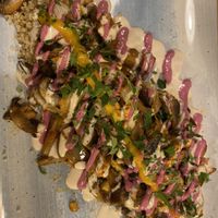 Quinoa, soy and mushroom with tahini saucee  at Aubergine in Bucharest