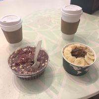 Açaí bowl (already stirred, couldn’t wait!) and cinnamon oatmeal with coffee drinks.  at The Green Cat in Virginia Beach